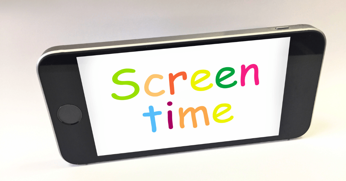 A smartphone with a white screen displays the words screen time in colorful, playful letters. The phone, angled against a plain background, highlights the concept of tracking daily screen time.